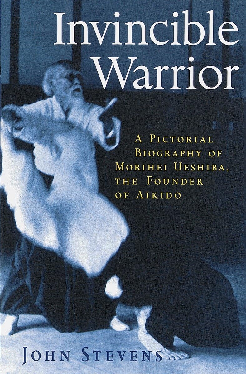 Invincible Warrior: A Pictorial Biography of Morihei Ueshiba, the Founder of Aikido Book by John Stevens (Preowned)