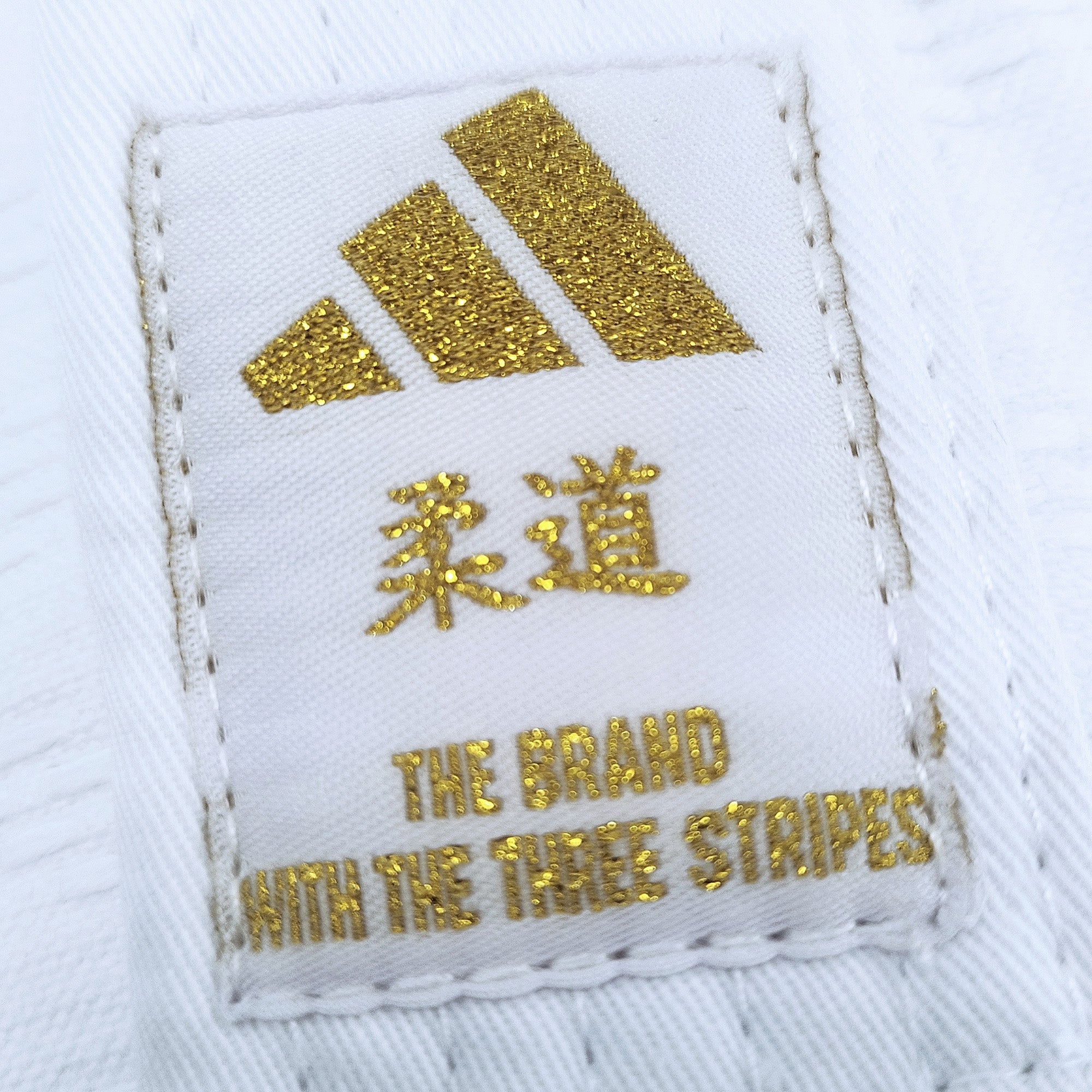 J690 Quest Gold Stripes Judo Gi by Adidas (White or Blue